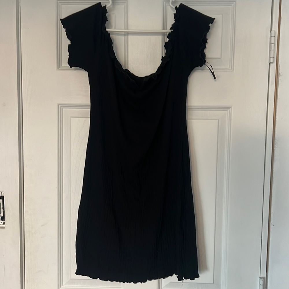 Short black dress with ruffled hem